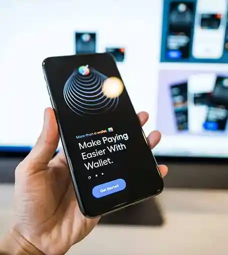 Smartphone displaying a wallet app with the text 'Make Paying Easier with Wallet' on the screen